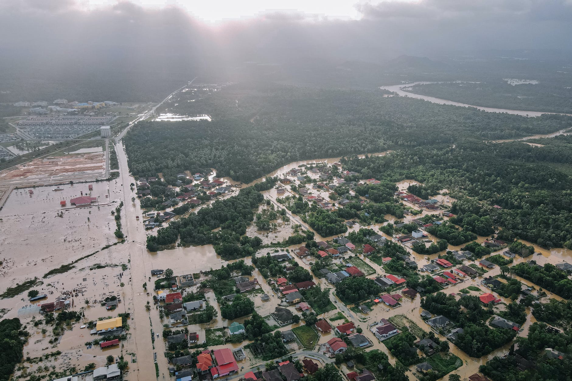 flooded small village with green trees